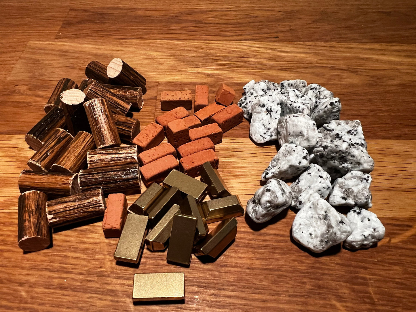 Premium Stone Age resources (wood, bricks, stone and gold), custom board game token upgrades